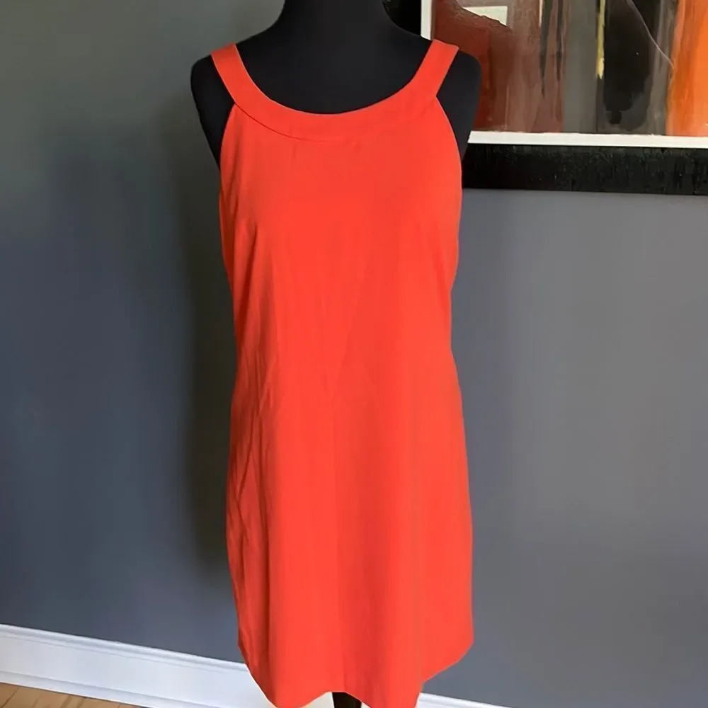Camaieu muted orange crepe halter midi w/ black ribbon tie open back. Size 8.
